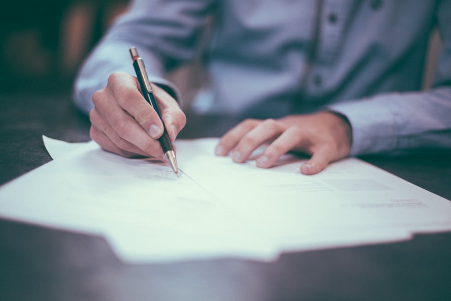 Signing a legal document with a pen